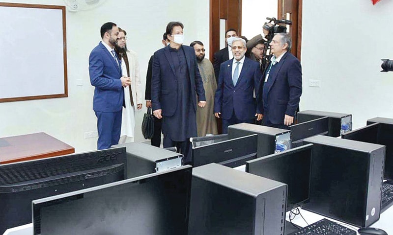 JHELUM: Prime Minister Imran Khan visits a section of the newly built academic blocks of Al-Qadir University in Sohawa on Monday. — APP