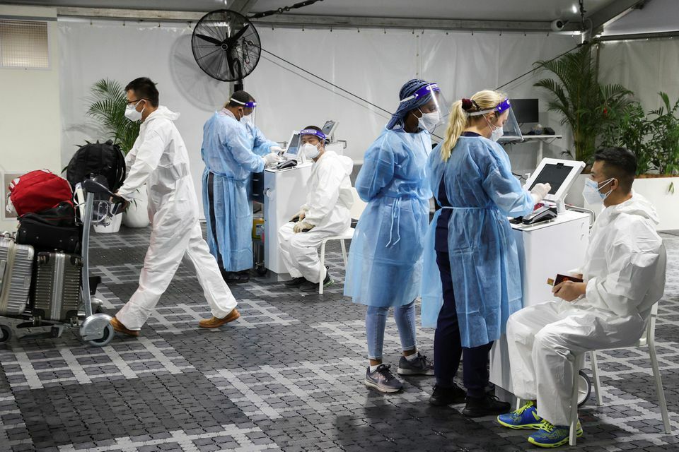 Travellers receive tests for the coronavirus at a pre-departure testing facility outside the international terminal at Sydney Airport in Sydney, Australia, November 29. — Reuters