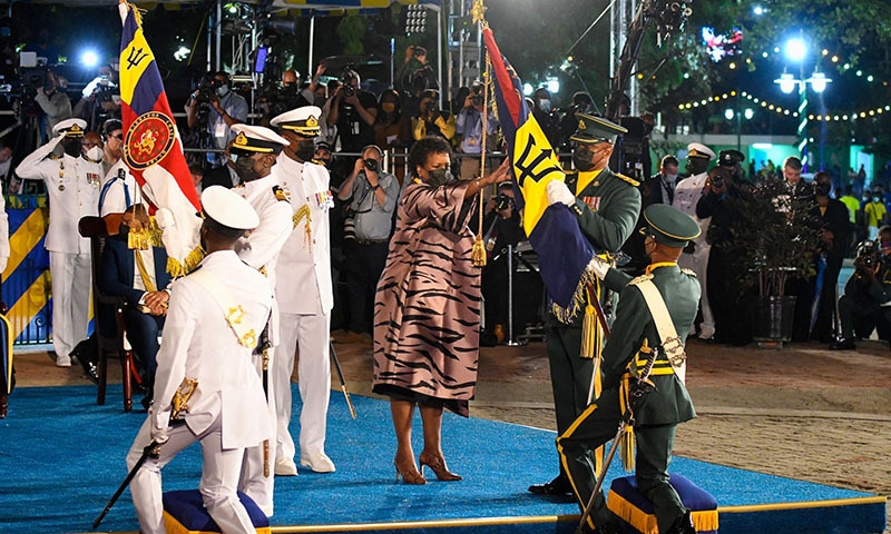 BRIDGETOWN: President Dame Sandra Mason (centre) receives the new colours during the ceremony to declare Barbados a republic and the inauguration of the president at the Heroes Square here on Tuesday.—AFP BRIDGETOWN: President Dame Sandra Mason (centre) receives the new colours during the ceremony to declare Barbados a republic and the inauguration of the president at the Heroes Square here on Tuesday.—AFP
