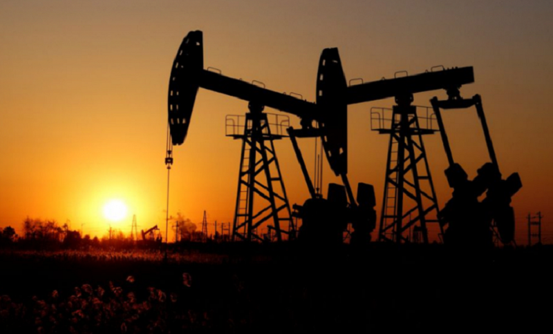 Pumpjacks are seen against the setting sun at the Daqing oil field in Heilongjiang province, China. —Reuters/File