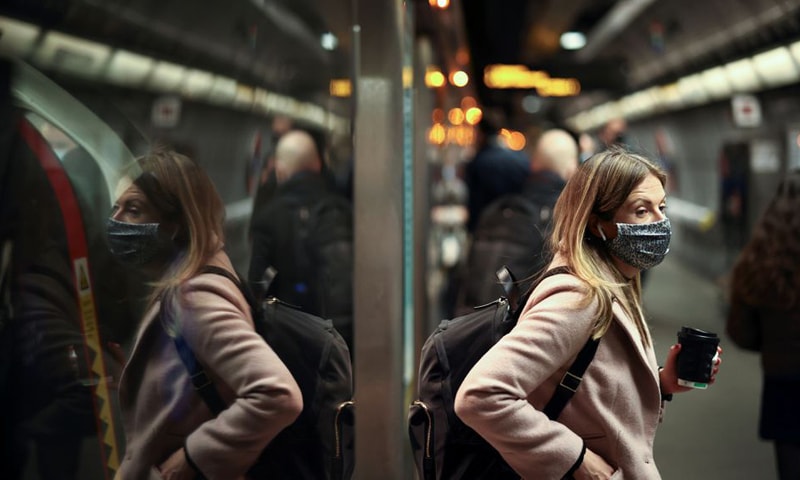 In this file photo, a woman exits a train at Westminster Underground station during morning rush hour in London, Britain. — Reuters/File