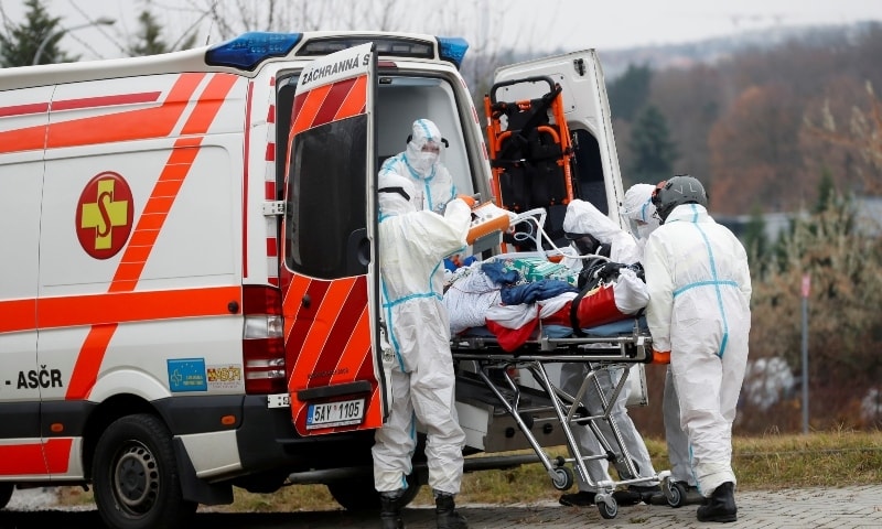 Medical workers transport a Covid-19 patient, who is being transferred from a Brno hospital, in Prague, Czech Republic on November 25. — Reuters