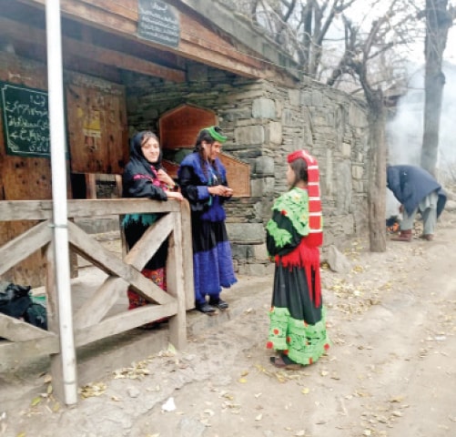 Kalash women at a bashaleni. — Dawn