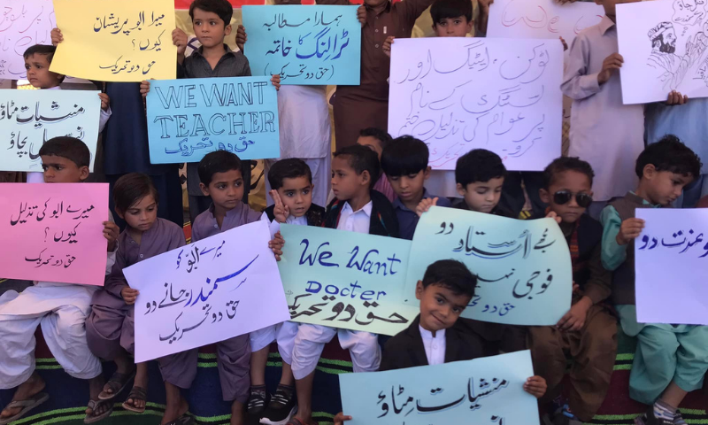 Children holding placards are seen during the sit-in in Gwadar on November 22. — Photo via Maulana Hidayat Ullah Baloch Twitter/File