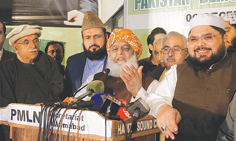 ISLAMABAD: Maulana Fazlur Rehman along with other leaders of the PDM speaks to reporters after a meeting of the opposition parties&rsquo; alliance on Monday.&mdash;Tanveer Shahzad / White Star