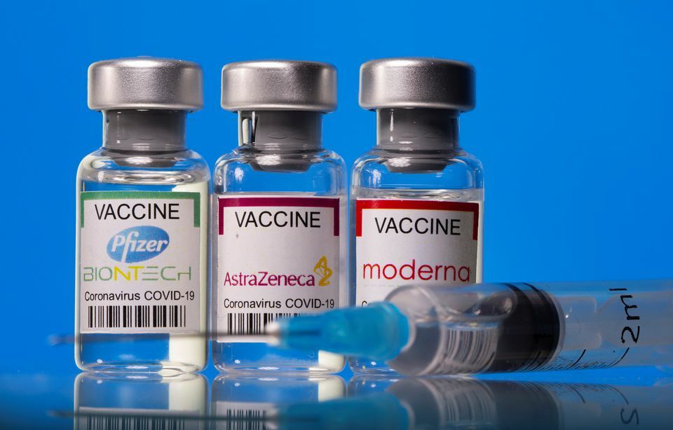 Vials with Pfizer-BioNTech, AstraZeneca, and Moderna coronavirus vaccine labels are seen in this illustration picture taken March 19. — Reuters