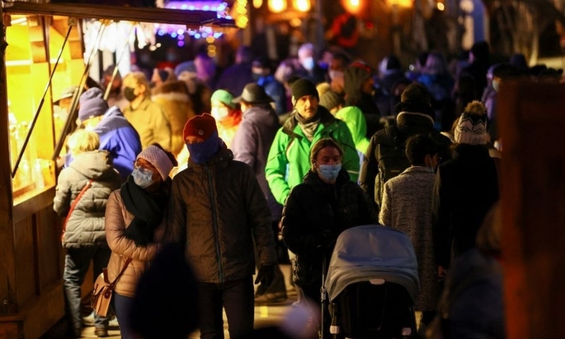 People wear masks at the Christmas Market, amid the coronavirus pandemic, in Montreux, Switzerland on December 6. — Reuters