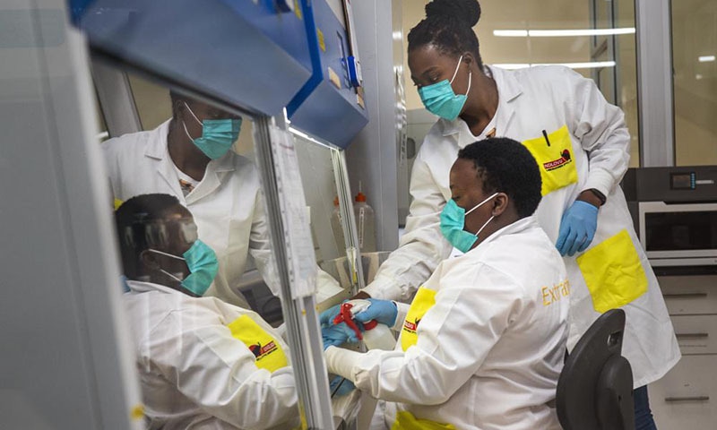 Melva Mlambo, right, and Puseletso Lesofi, both medical scientists prepare to sequence Covid-19 Omicron samples at the Ndlovu Research Centre in Elandsdoorn, South Africa. — AP/File