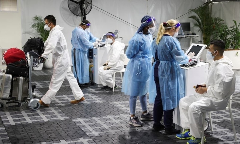 Travellers receive tests for Covid-19 at a pre-departure testing facility outside the international terminal at Sydney Airport in Sydney, Australia on November 29. &mdash; Reuters