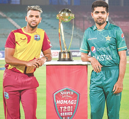 KARACHI: West Indies captain Nicholas Pooran (L) and his Pakistan counterpart Babar Azam pose with the T20 series trophy at the National Stadium on Sunday.—Courtesy PCB