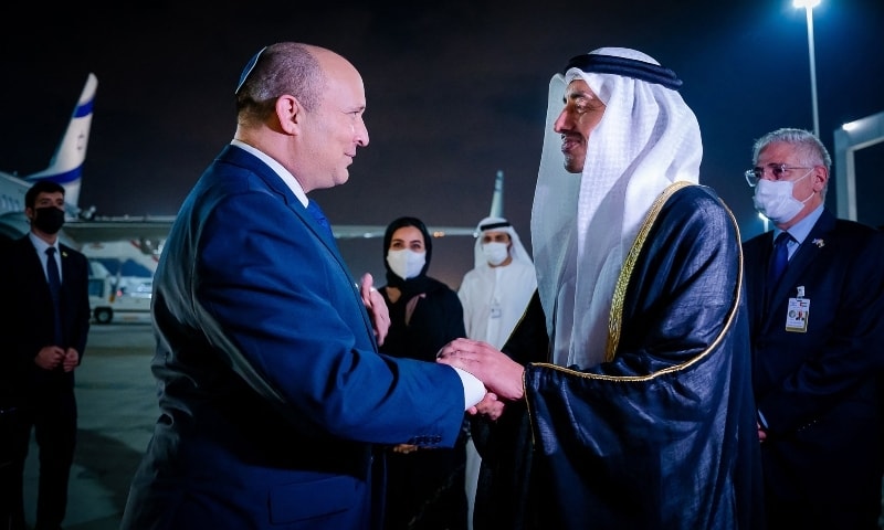 Minister of Foreign Affairs and International Cooperation HH Sheikh Abdullah bin Zayed Al Nahyan (R) welcomes Israeli Prime Minister Naftali Bennett upon his arrival at the Presidential Terminal at Abu Dhabi International Airport in Abu Dhabi, UAE on December 12. — AFP