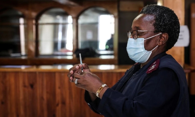 A healthcare worker prepares a dose of the Pfizer Covid-19 vaccine in Johannesburg, South Africa on December 9. — Reuters