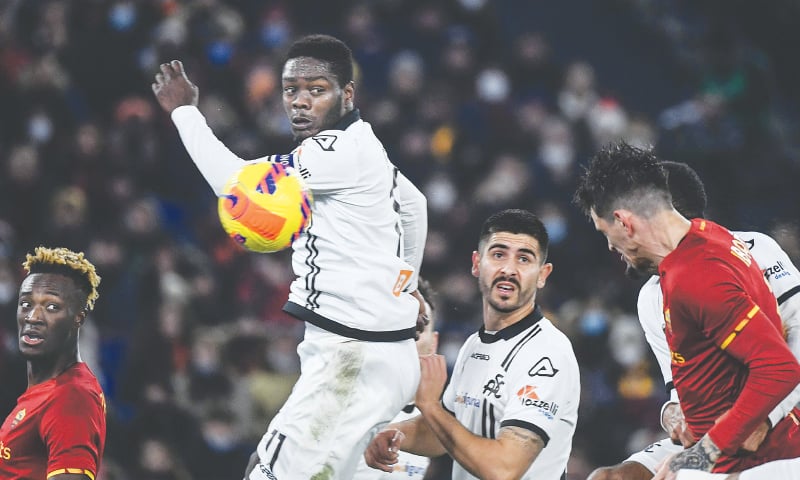 ROME: Roger Ibanez (R) of AS Roma scores against Spezia during their Serie A match at the Olympic Stadium.—AFP ROME: Roger Ibanez (R) of AS Roma scores against Spezia during their Serie A match at the Olympic Stadium.—AFP