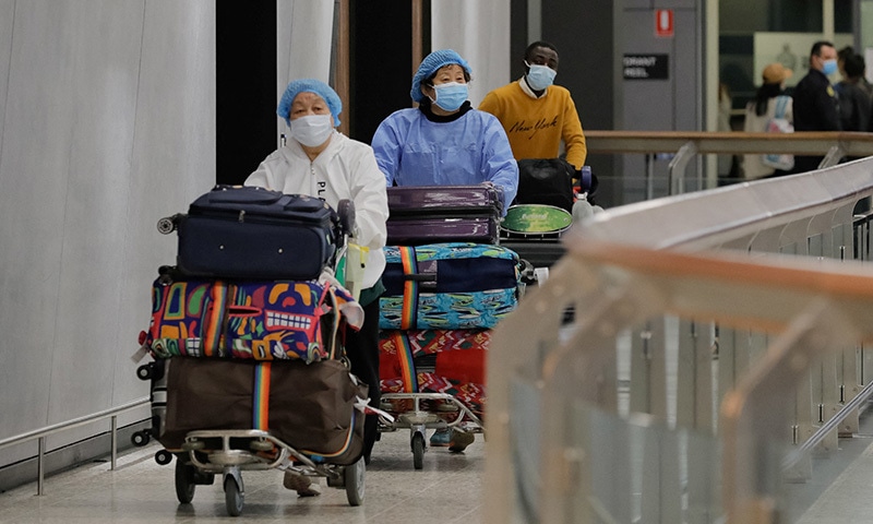 Passengers arrive at Melbourne International Airport, as international borders reopened to vaccinated skilled migrants and foreign students after a nearly two-year ban on their entry, in Melbourne, Australia, on Wednesday. — Reuters