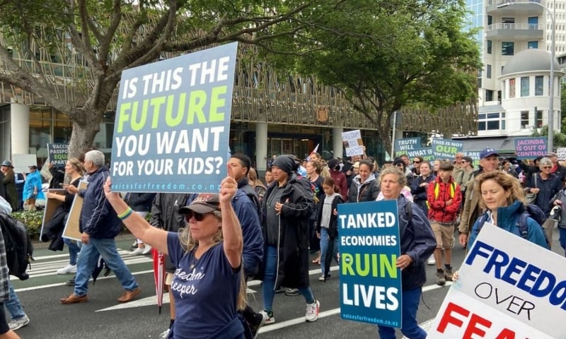 Anti-vaccine mandate protesters march through the city and gather in front of the parliament in Wellington, New Zealand, December 16. — Reuters