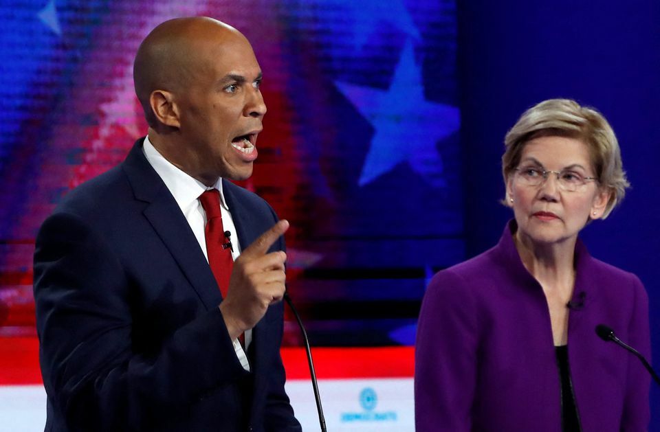 US Senator Cory Booker speaks as US Senator Elizabeth Warren listens at the first US 2020 presidential election Democratic candidates debate in Miami, Florida, US, June 26, 2019. — Reuters/File