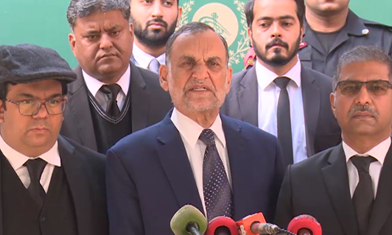 Railways Minister Azam Swati talks to media outside the ECP office in Islamabad on Wednesday. — DawnNewsTV