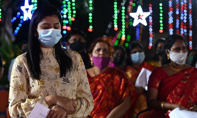 Christian devotees pray at Our Lady of Light Church on Christmas Eve in Chennai, on December 24. — AFP