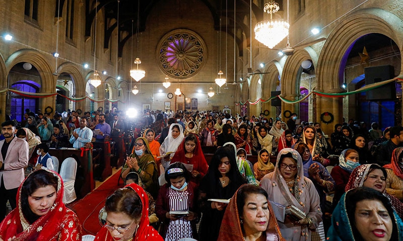 People pray during a Christmas Eve service at St. Andrew's Church in Karachi, on Friday. — Reuters