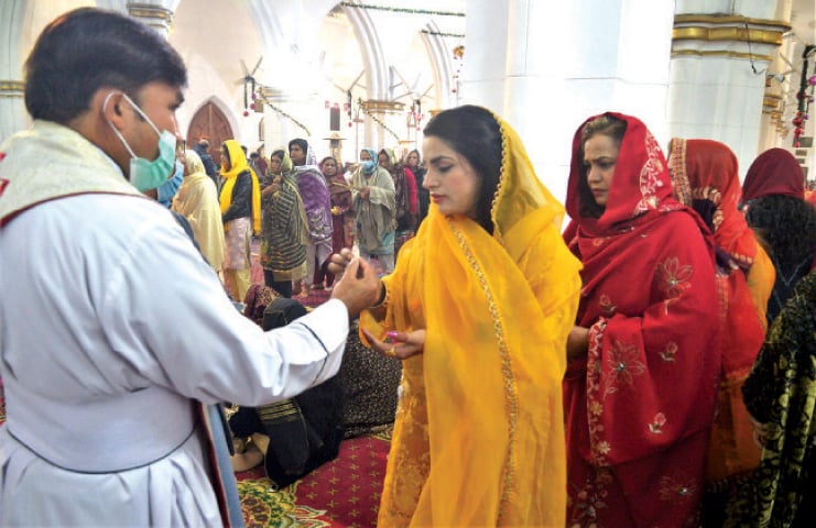 Members of Christian community attend a special service of Christmas at the St John&rsquo;s Cathedral Church in Peshawar on Saturday. &mdash; White Star