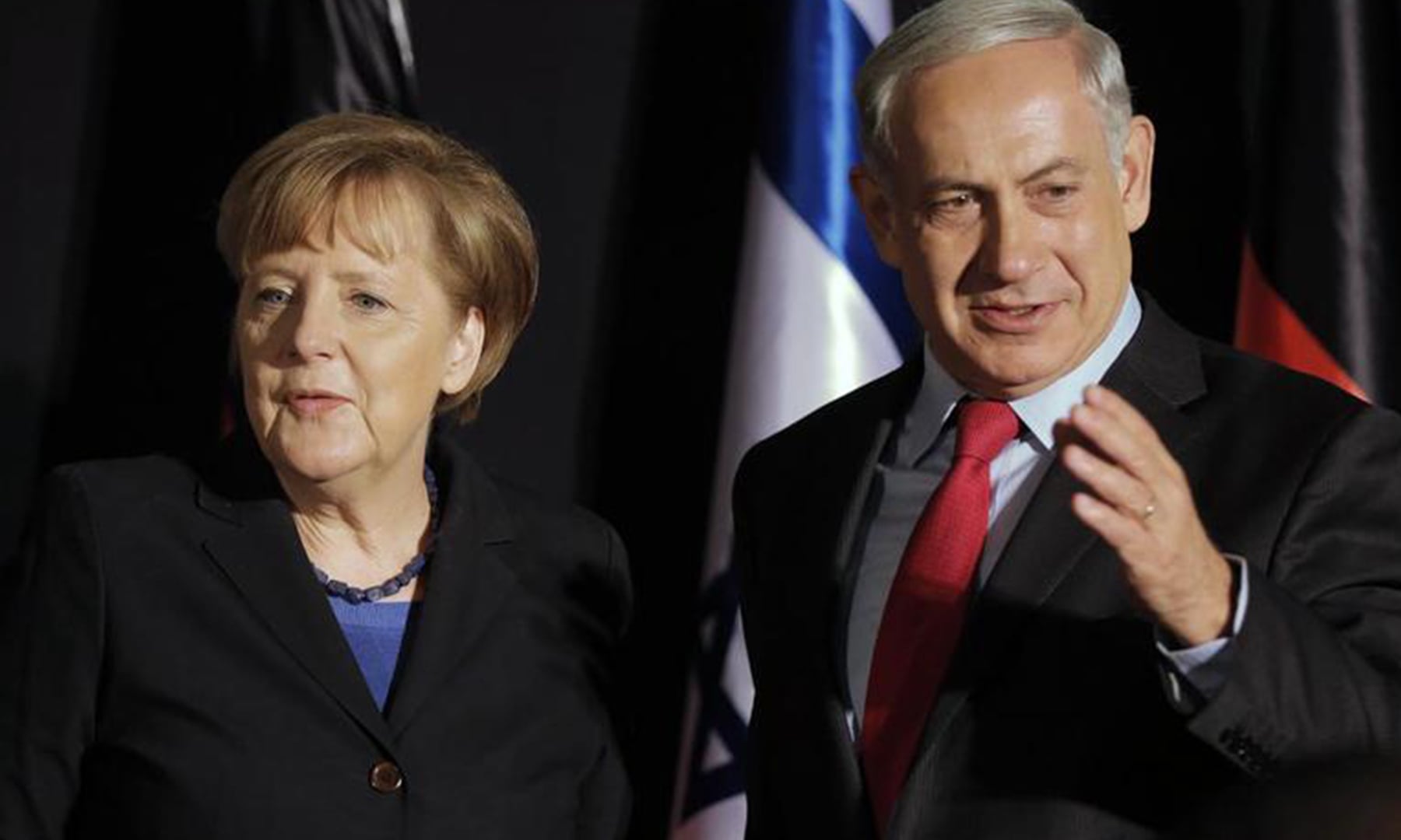 Former prime minister of Israel, Benjamin Netanyahu (R), stands next to erstwhile German chancellor Angela Merkel after a joint news conference in Jerusalem on February 25, 2014. — Reuters/File