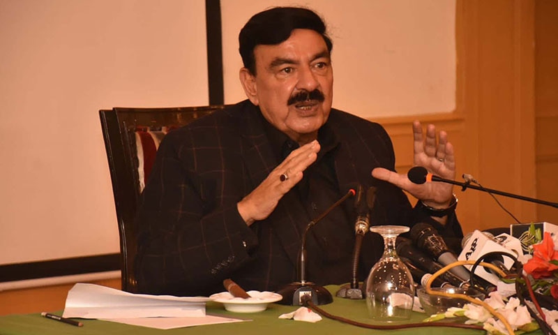 Interior Minister Sheikh Rashid Ahmed addresses a press conference in Karachi. — PID