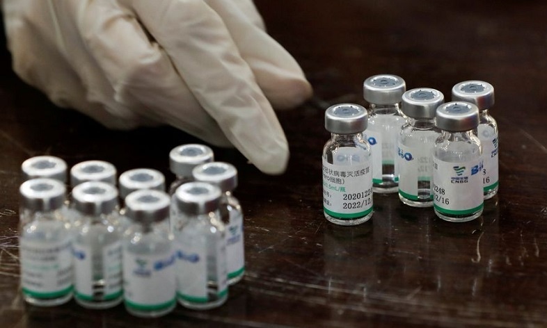 In this file photo, a health worker counts used vials of Sinopharm's coronavirus disease vaccine at a vaccination centre. — Reuters/File
