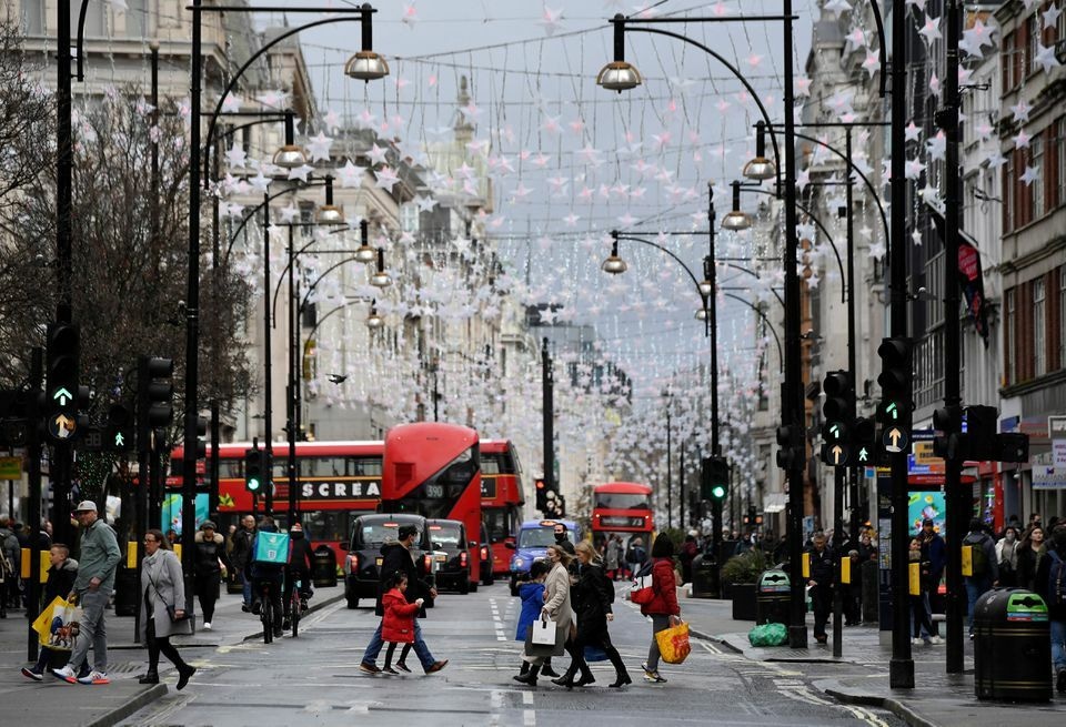 Shoppers cross Oxford Street, London, Britain, December 28. — Reuters