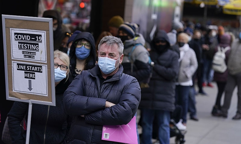 People wait in line at a Covid-19 testing site in New York Times Square, US. — AP/File