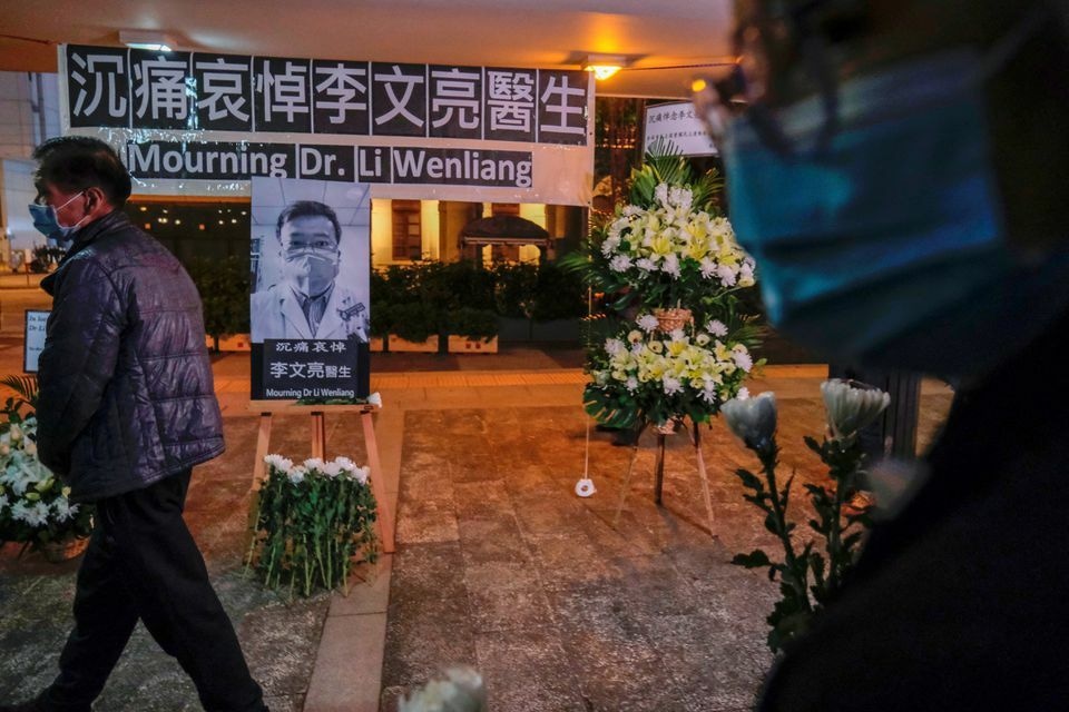 People wearing masks attend a vigil for late Li Wenliang, an ophthalmologist who died of coronavirus at a hospital in Wuhan, in Hong Kong, China, February 7, 2020. — Reuters/File