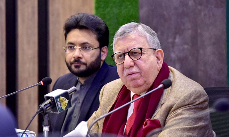 Finance Minister Shaukat Tarin addresses a press conference in Islamabad alongside Minister of State for Information and Broadcasting Farrukh Habib on Thursday. — PID