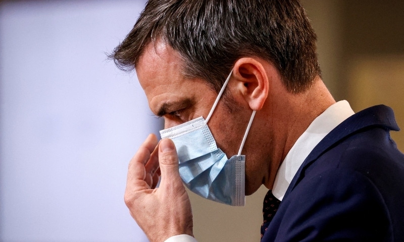 French Health Minister Olivier Veran adjusts his protective mask during a news conference on the Covid-19 outbreak, in Paris, France on December 10, 2020. &mdash; Reuters
