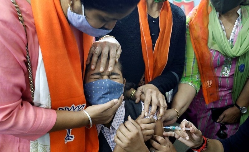 A girl reacts as she receives a dose of Bharat Biotech's Covid-19 vaccine, Covaxin, during a vaccination drive for children aged 15-18 years in Ahmedabad, India on Monday. — Reuters