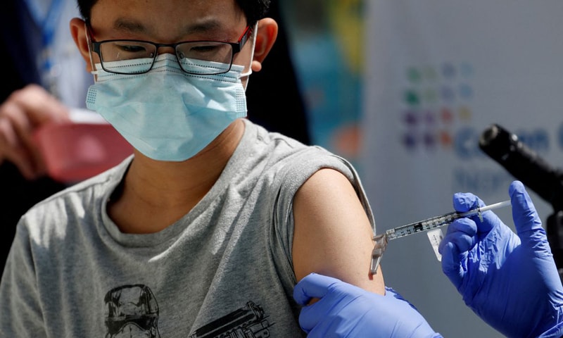 In this file photo, a boy receives a dose of the Pfizer-BioNTech vaccine at Northwell Health's Cohen Children's Medical Centre in New Hyde Park, New York. &mdash; Reuters/File
