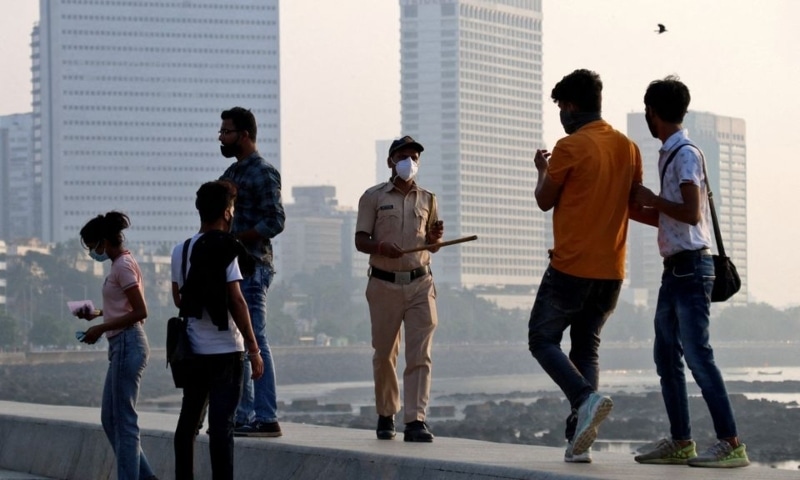 A policeman asks people to leave the promenade at Marine drive, during restrictions to limit public gatherings amidst the spread of the coronavirus, in Mumbai, India, January 3. — Reuters