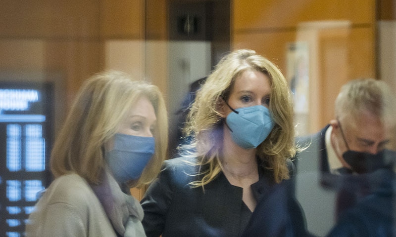 Elizabeth Holmes, centre, enters a federal court in San Jose, California, US, on Monday. — AP