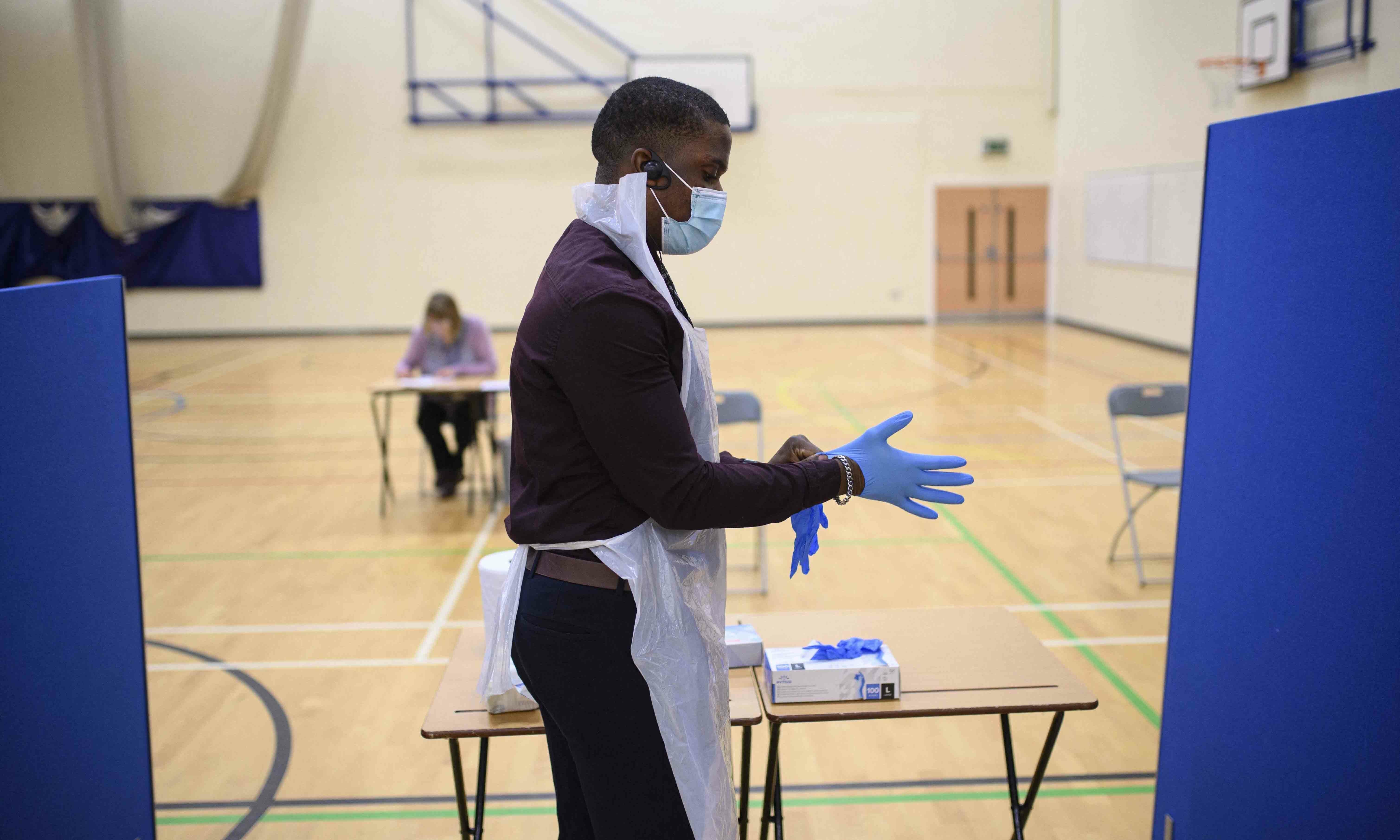 Staff at Park Lane Academy prepare to process Covid lateral flow tests as they undertake a programme to test every pupil on the first day of term, in Halifax, northwest England on January 4. &mdash; AFP