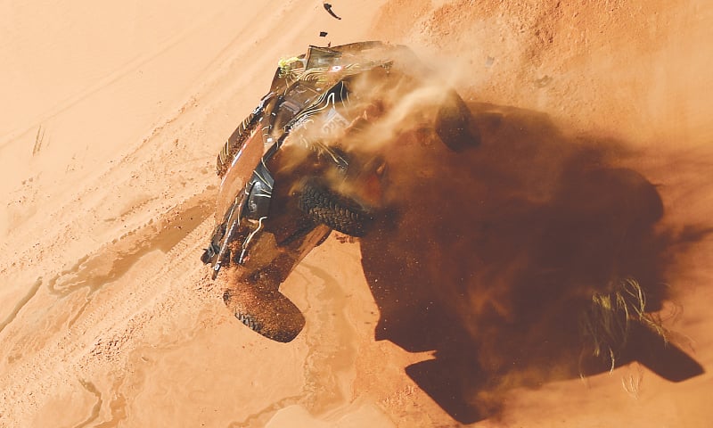 FRANCE’S Guerlain Chicherit and co-driver Alex Winocq crash their buggy during the fourth stage of the Dakar Rally between Al-Qaysumah and Riyadh on Wednesday.—AFP FRANCE’S Guerlain Chicherit and co-driver Alex Winocq crash their buggy during the fourth stage of the Dakar Rally between Al-Qaysumah and Riyadh on Wednesday.—AFP