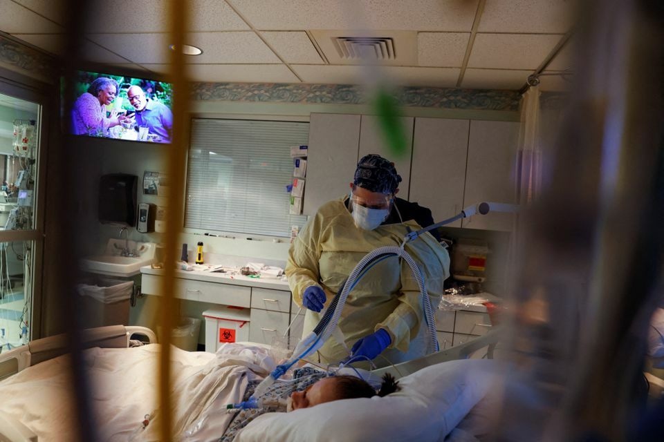 Medical staff treat a coronavirus patient in their isolation room in the intensive care unit at Western Reserve Hospital in Cuyahoga Falls, Ohio, US, January 5. — Reuters