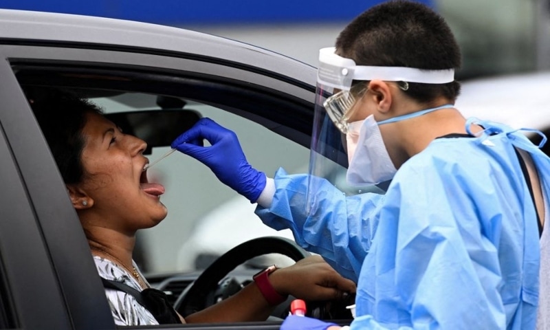 A woman takes a test for the coronavirus at a testing centre in Sydney, Australia, January 5. &mdash; Reuters