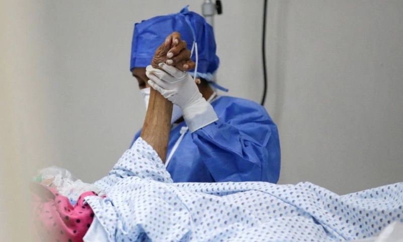 A medical staff member checks symptoms of a coronavirus patient in the emergency room at Metropolitano Hospital in Monterrey, Mexico, January 6. — Reuters