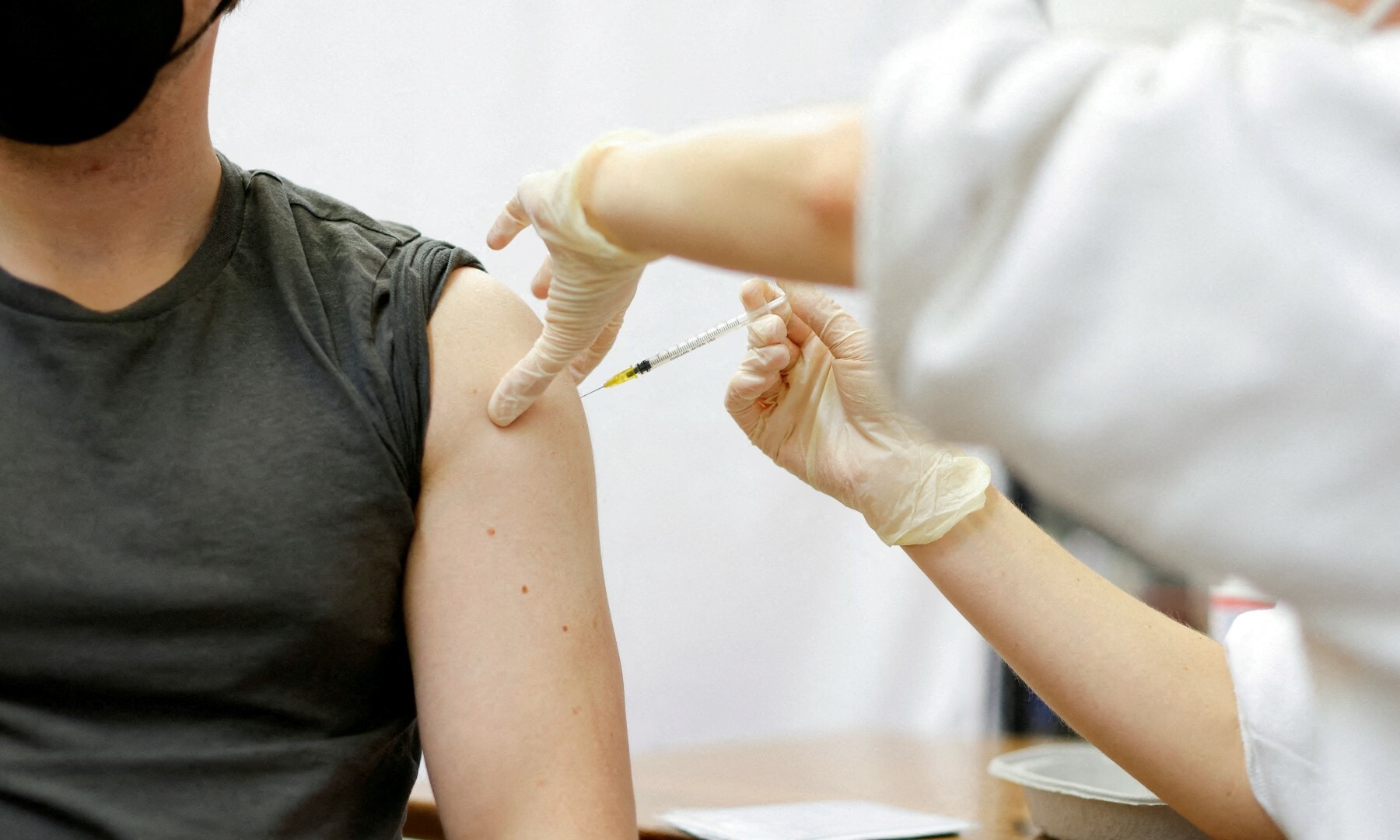 A medic administers a booster dose of the Moderna Covid-19 vaccine, Spikevax, against the coronavirus disease at a vaccination centre in Berlin on January 1. &mdash; Reuters