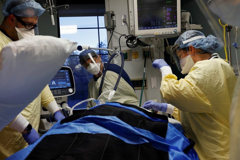 Medical staff treat a coronavirus patient in their isolation room in the intensive care unit at Western Reserve Hospital in Cuyahoga Falls, Ohio, US, January 4. — Reuters
