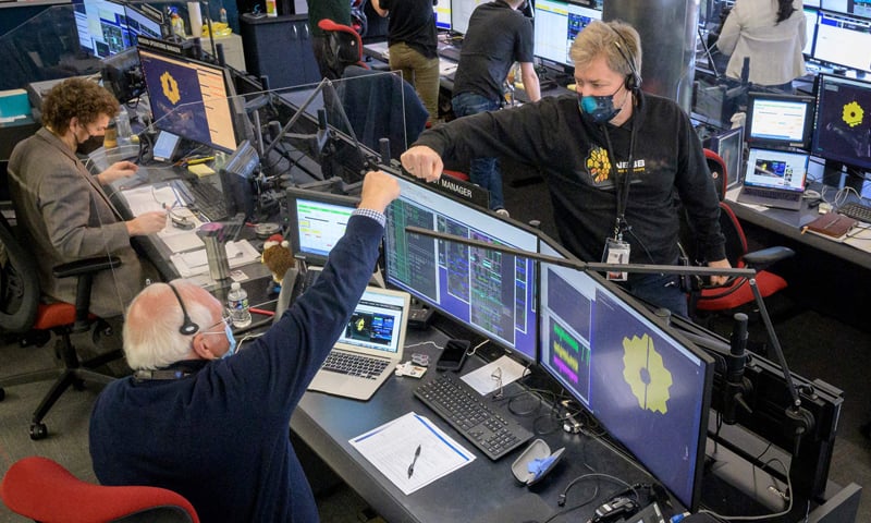 In this photo released by Nasa, engineering teams celebrate at the Space Telescope Science Institute in Baltimore, Maryland as the second primary mirror wing of Nasa's James Webb Space Telescope unfolds, before beginning the process of latching the mirror wing into place. — AFP