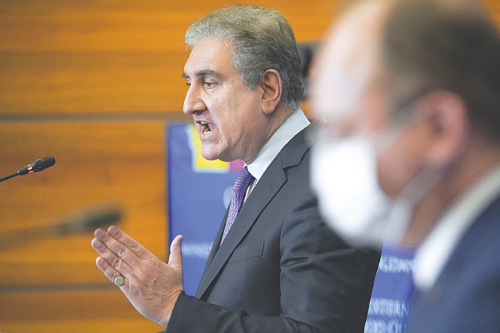 Foreign Minister Shah Mahmood Qureshi speaks at the joint press conference with his Romanian counterpart Bogdan Aurescu.—AP