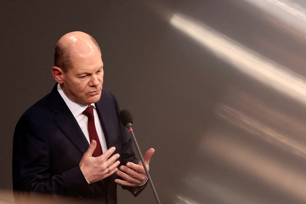 German Chancellor Olaf Scholz speaks during his first questioning session with lawmakers at the lower house of parliament Bundestag in Berlin on January 12. &mdash; Reuters