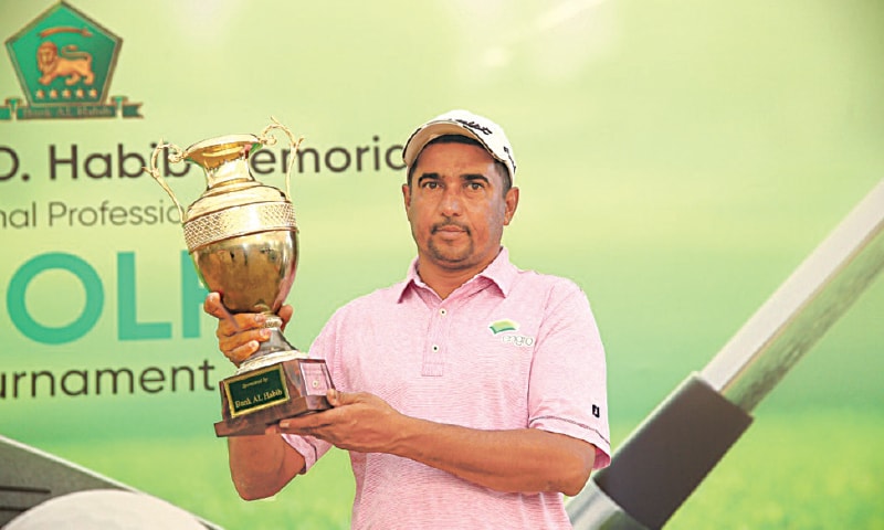 WAHEED Baloch poses with the trophy after winning the Rashid D. Habib Memorial National Professional Golf Tournament on Sunday.