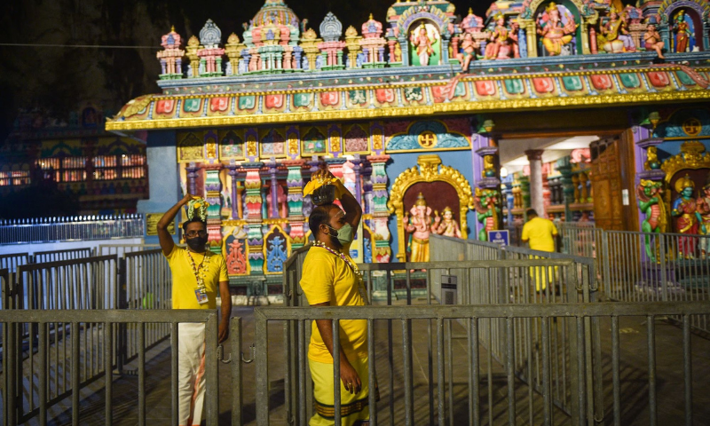 A group of Hindu devotees carry “Paal Kudam” (milk pots) ahead of the Thaipusam festival in Kuala Lumpur on Monday. — AFP