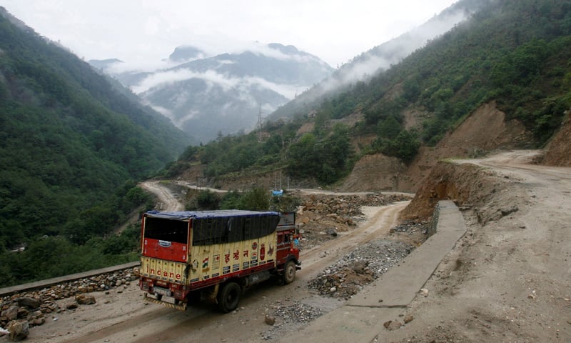 A delivery truck drives along India's Tezpur-Tawang highway that runs to the Chinese border, in the northeastern Indian state of Arunachal Pradesh on May 29, 2012. &mdash; Reuters/File
