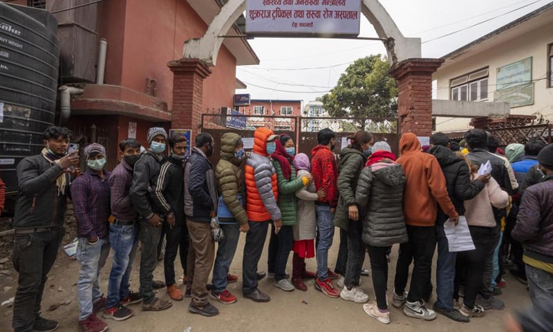 Nepalese people queue up to get vaccinated after government made vaccination cards mandatory for people to access public services in Kathmandu, Nepal. — AP